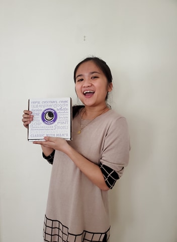 HTA Giselle Garcia with a box of cookies