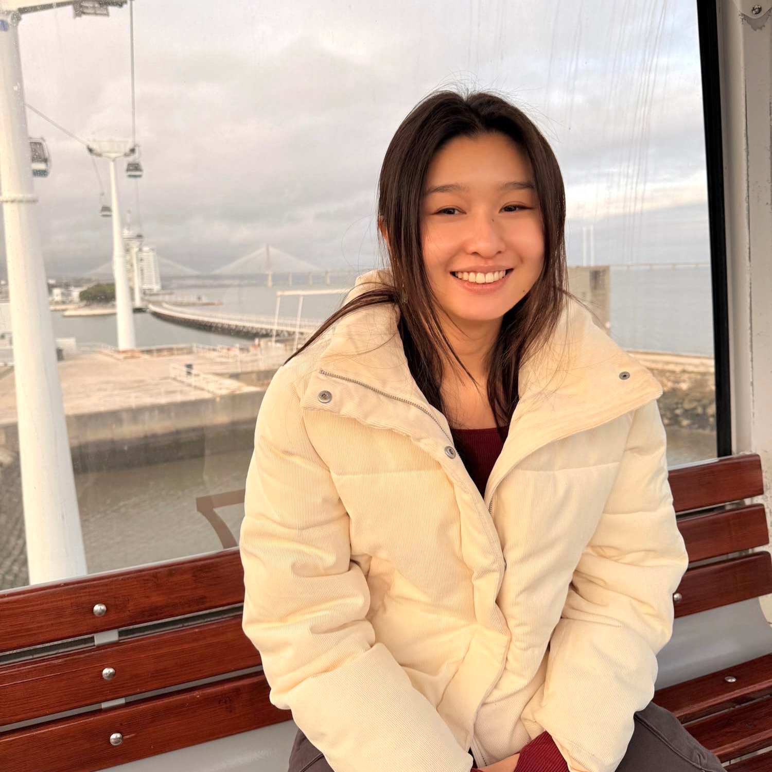 A smiling girl with brown hair.