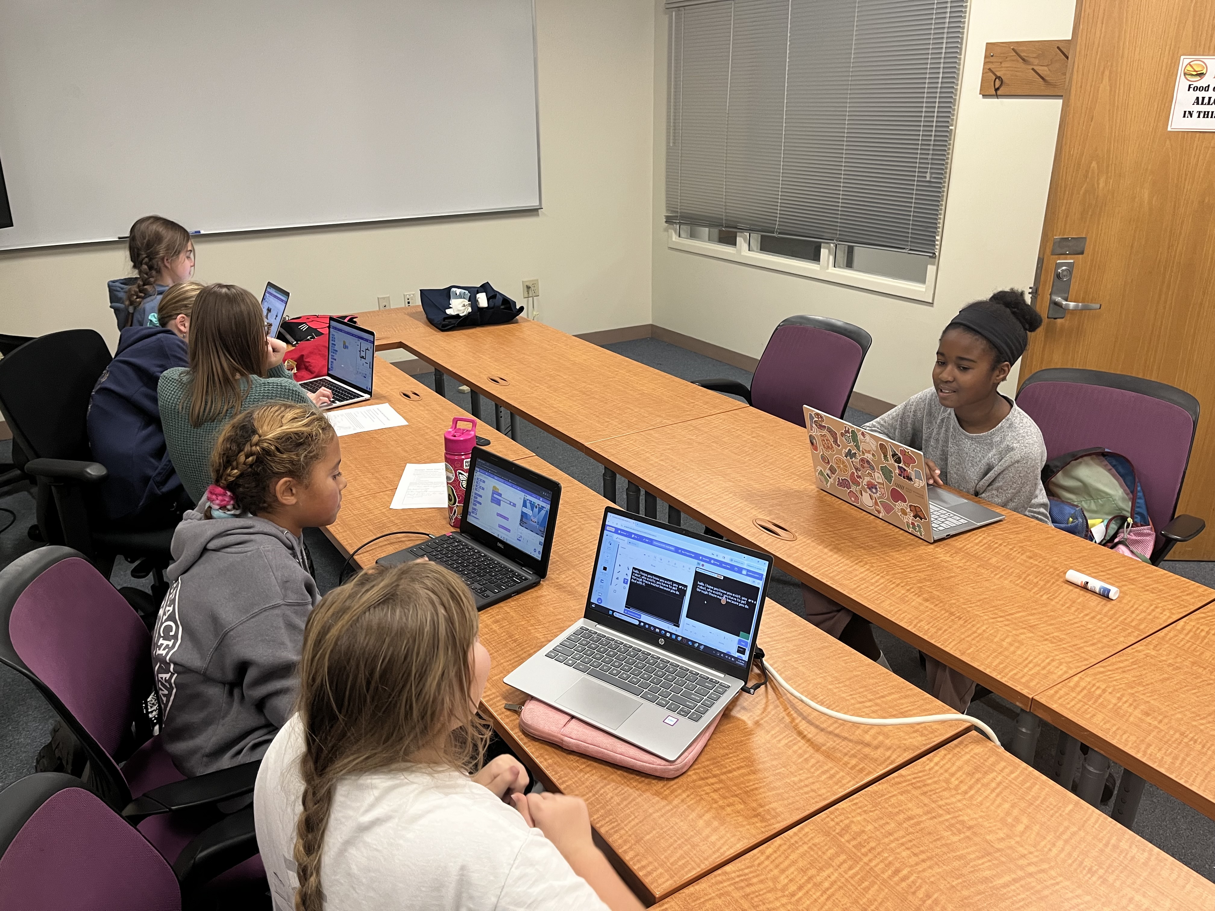Students coding in Scratch