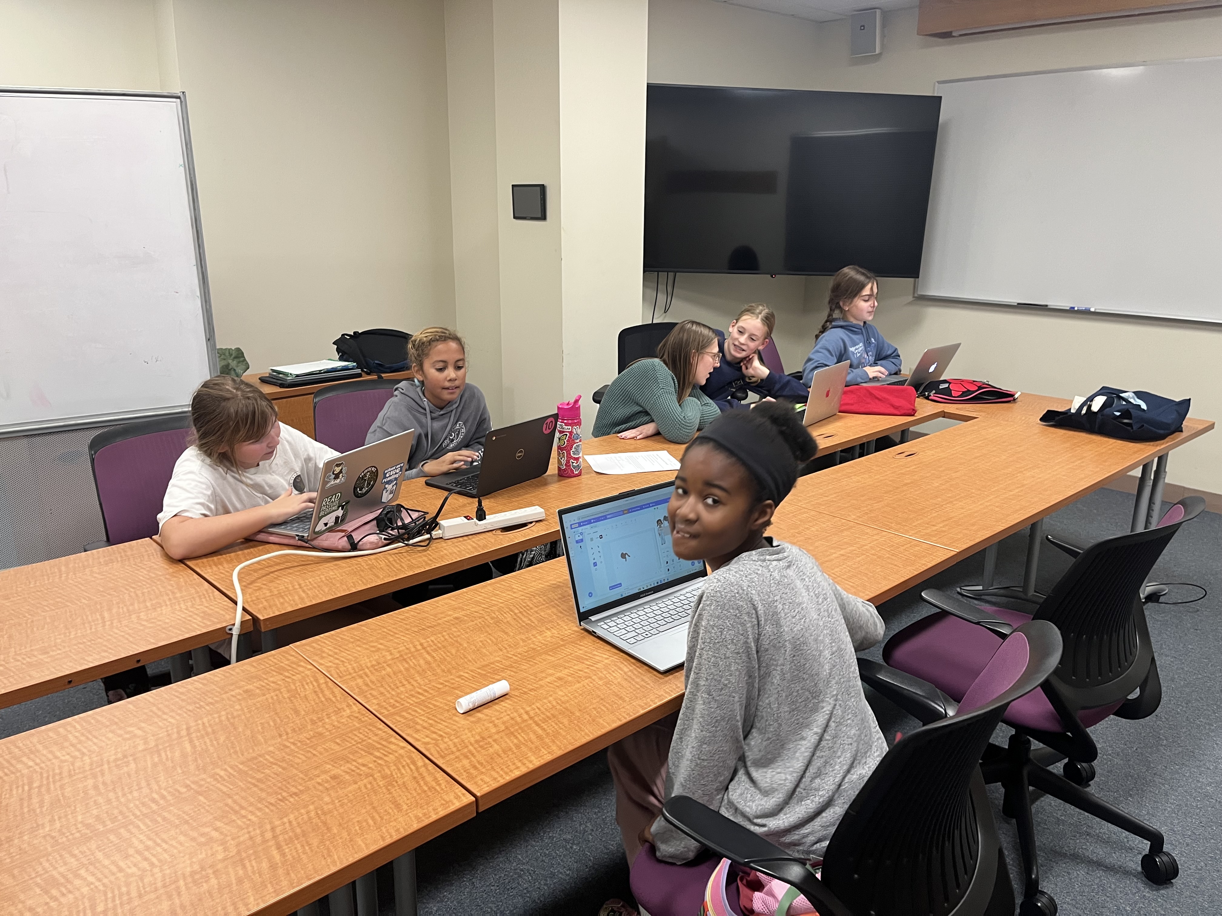 Students coding in Scratch